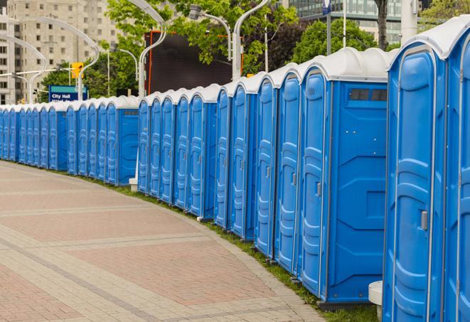 a line of portable restrooms set up for a wedding or special event, ensuring guests have access to comfortable and clean facilities throughout the duration of the celebration in Lake Helen FL